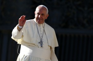 Pope Francis waves as he leaves at the end of his general audience in Saint Peter's Square at the Vatican