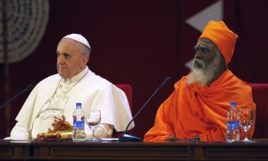 Pope Francis sits next to Hindu Ndu-Kurukkal SivaSri T. Mahadeva during the Interreligious Encounter at the Bmich in Colombo